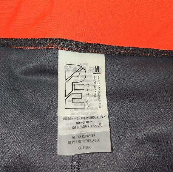 P.E Nation Women's The Glory Leggings - Black/Orange/White Medium Compression - Picture 7 of 8